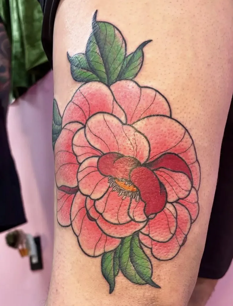 Coral peony in bloom with green leaves, Japanese-style tattoo