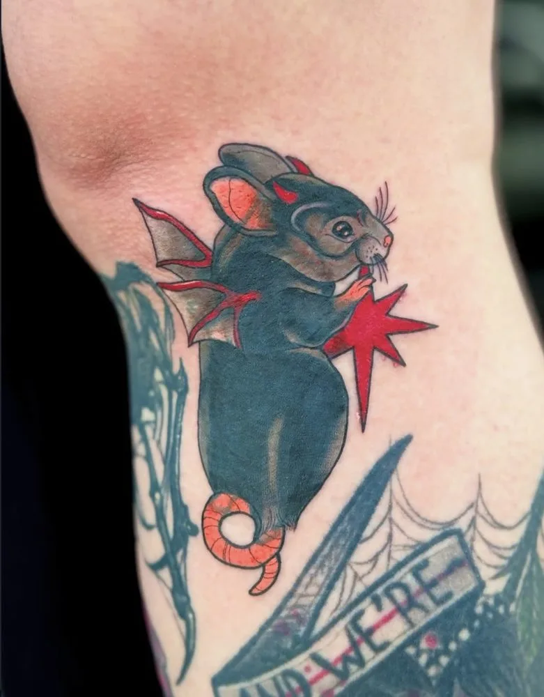 Neo-traditional rat with small devil wings and a red star tattoo